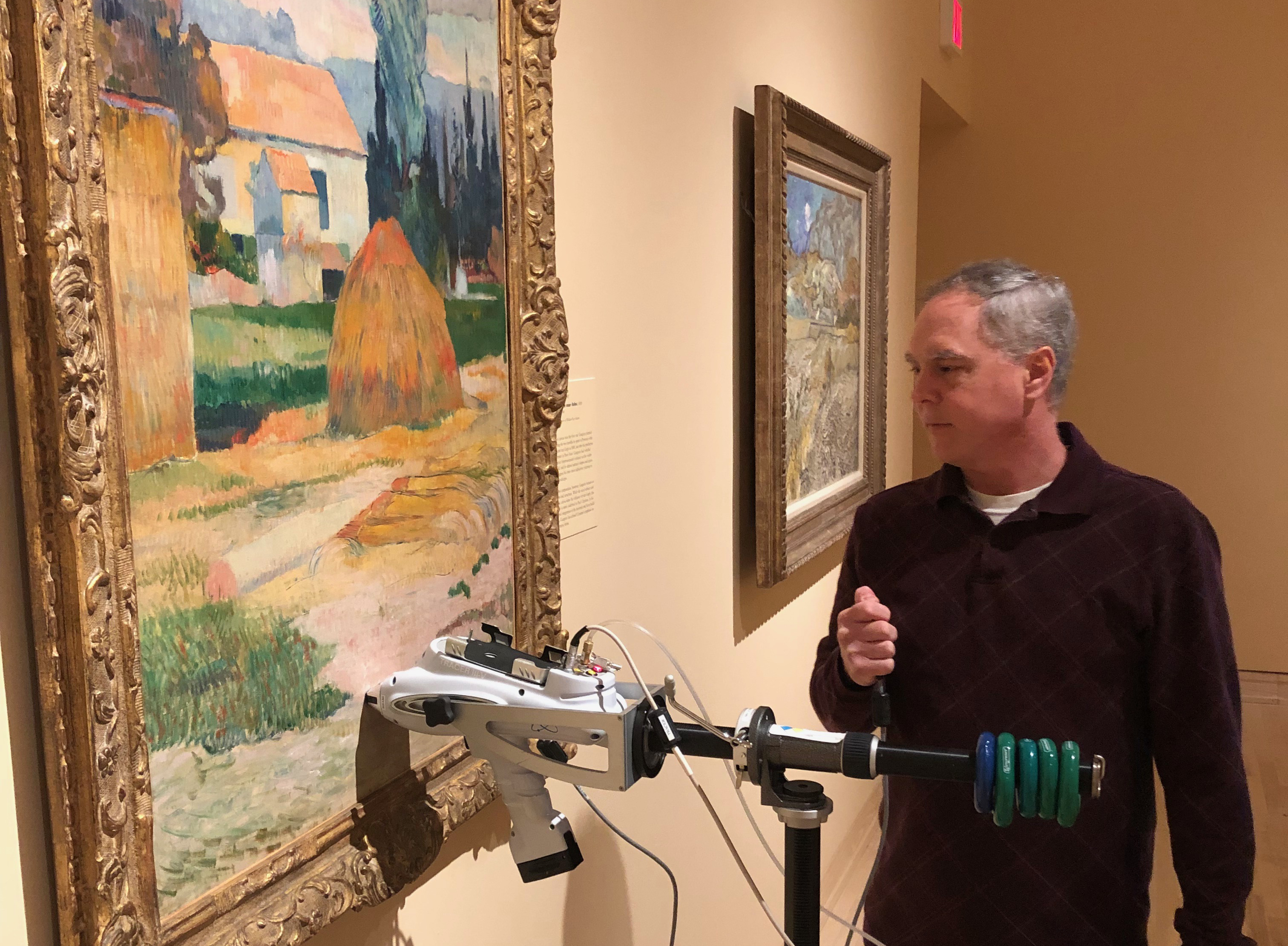 Project MUSE scholar Dr. Jeff Fieberg, physical chemistry professor at Centre College, analyzing pigments in Gauguin's <i>Landscape Near Arles</i> (44.10) at Newfields.